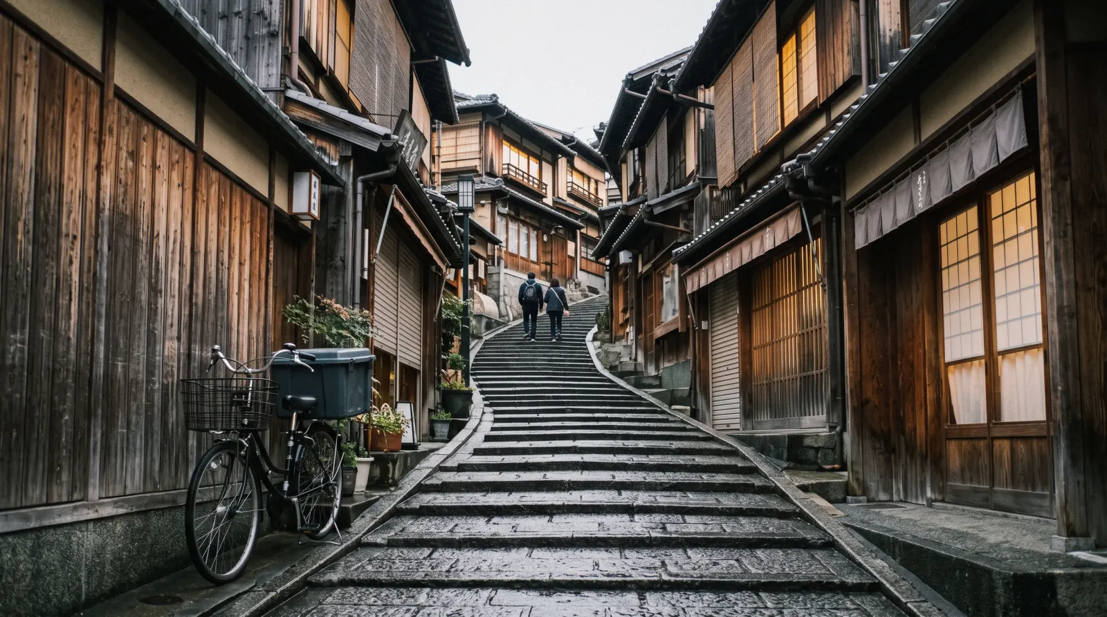 The stone steps of Sannenzaka in Higashiyama at 07:15 with the shopfronts still shuttered, Kyoto