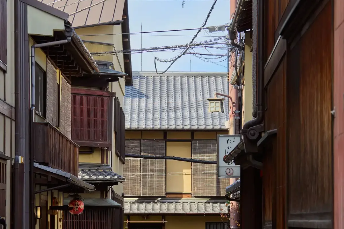 A narrow street of wooden machiya townhouses in Gion, Kyoto