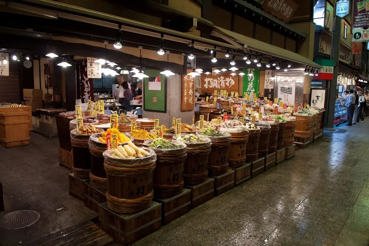 Trays of Kyoto pickles on a tsukemono counter in Nishiki Market